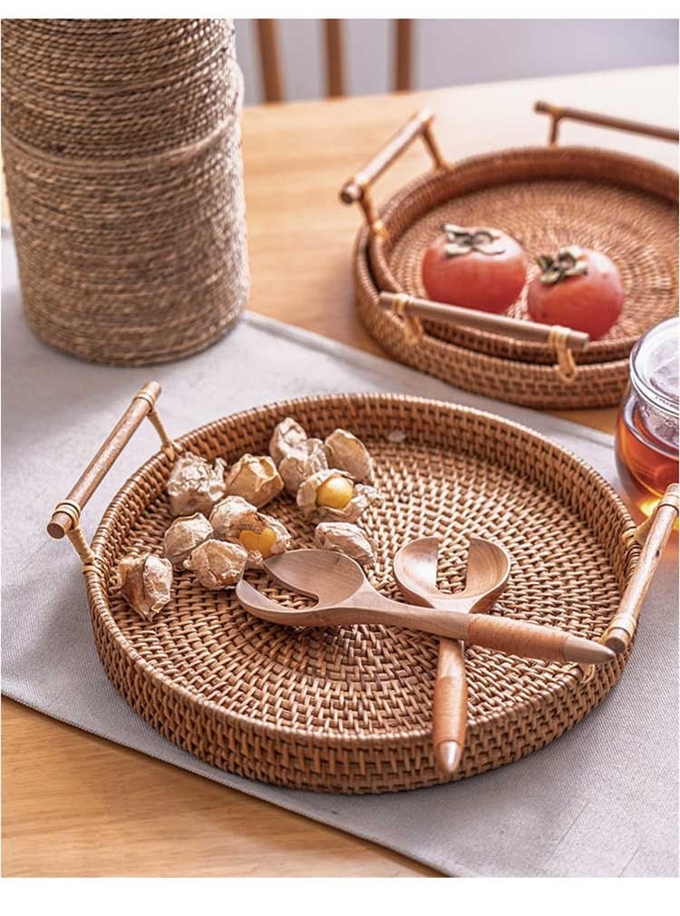 Round rattan tray with solid wood handles – shown in a room setting (2)