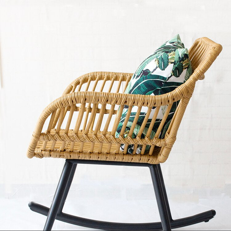 Light honey rattan rocking chair with soft curves – shown in a room setting (2)