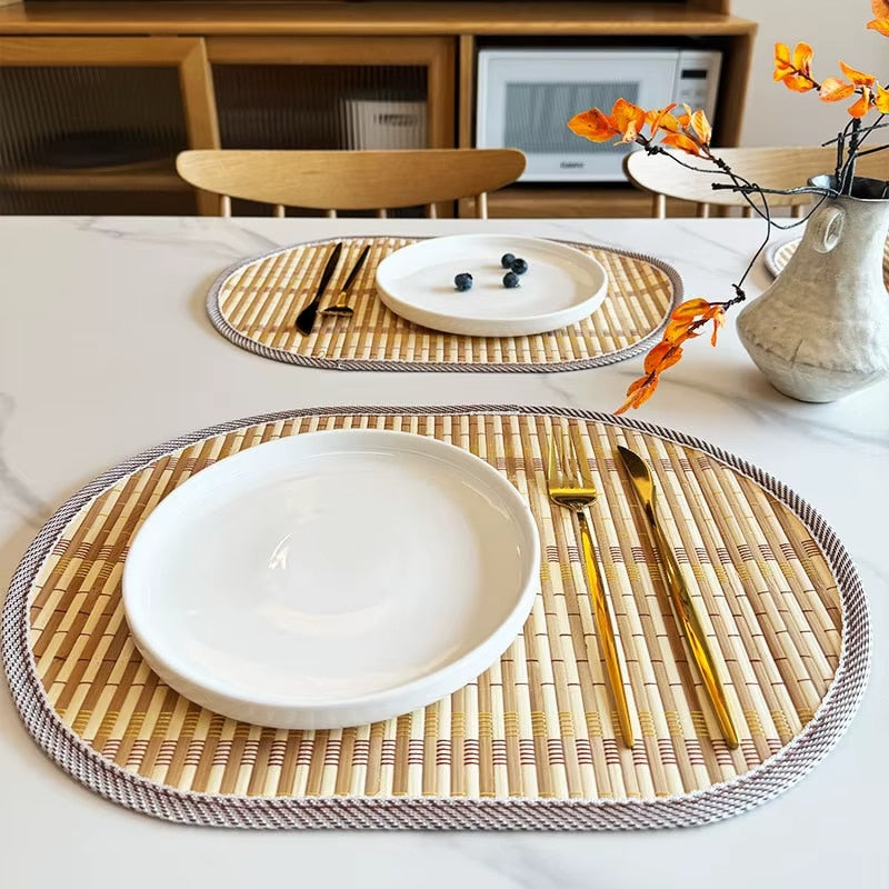 Oval Nordic handwoven bamboo placemat – shown in a room setting (2)