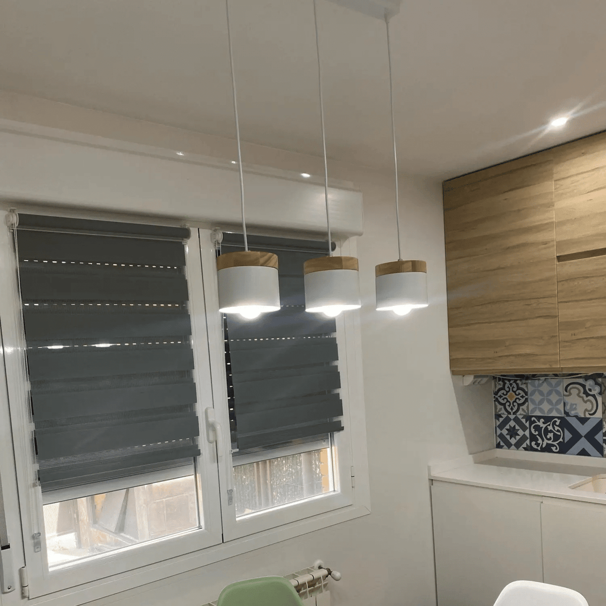 Modern LED wood slat and brushed aluminum ring pendant – shown in a room setting