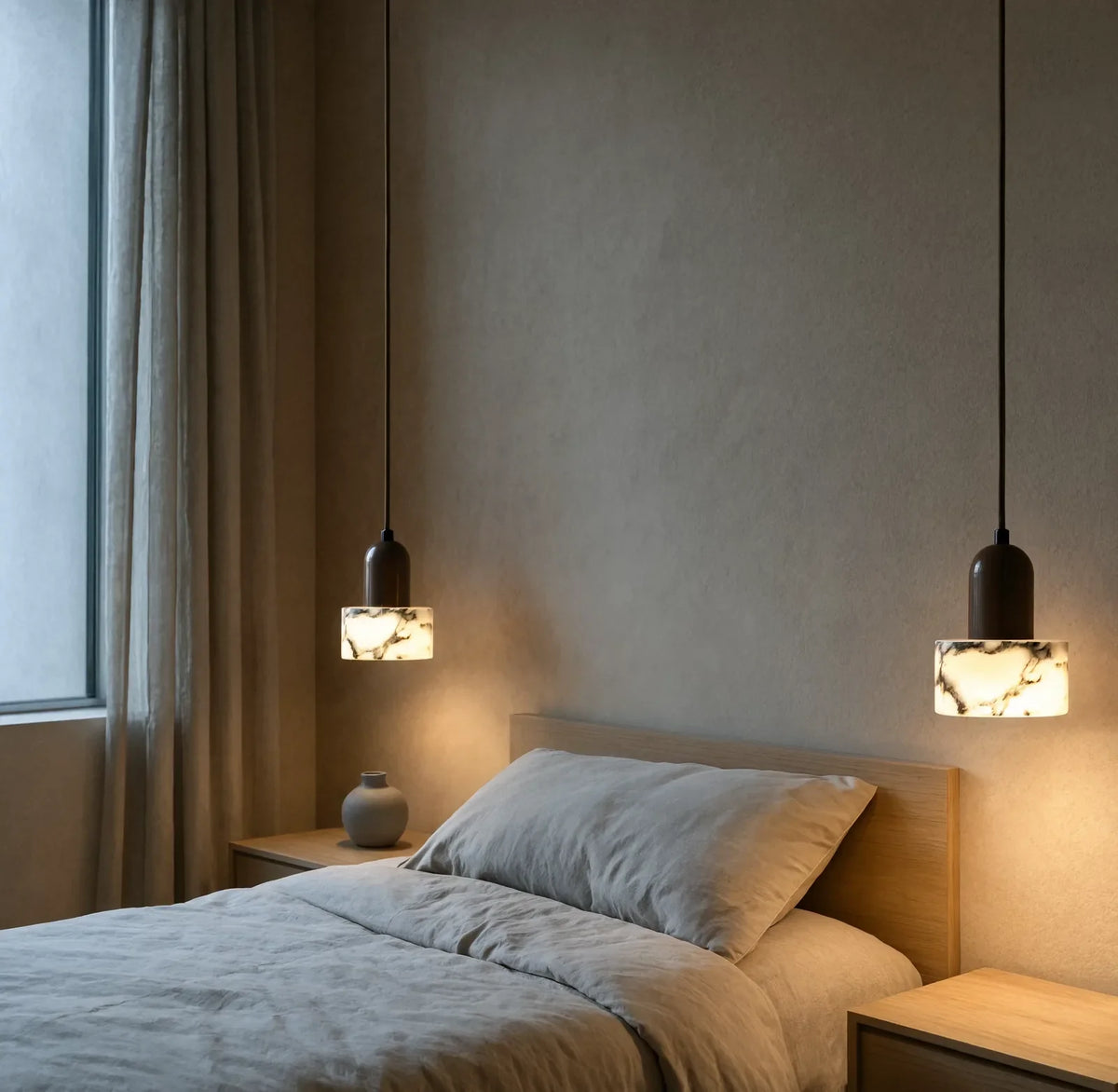 Himère marble and dark wood pendant light – shown in a bedroom