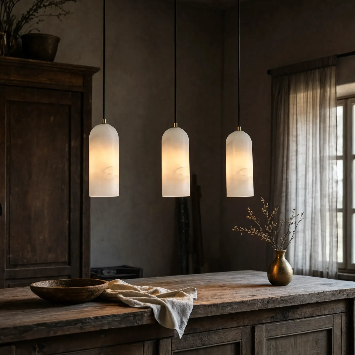 Tarente translucent marble pendant light with brushed brass canopy – shown in a kitchen