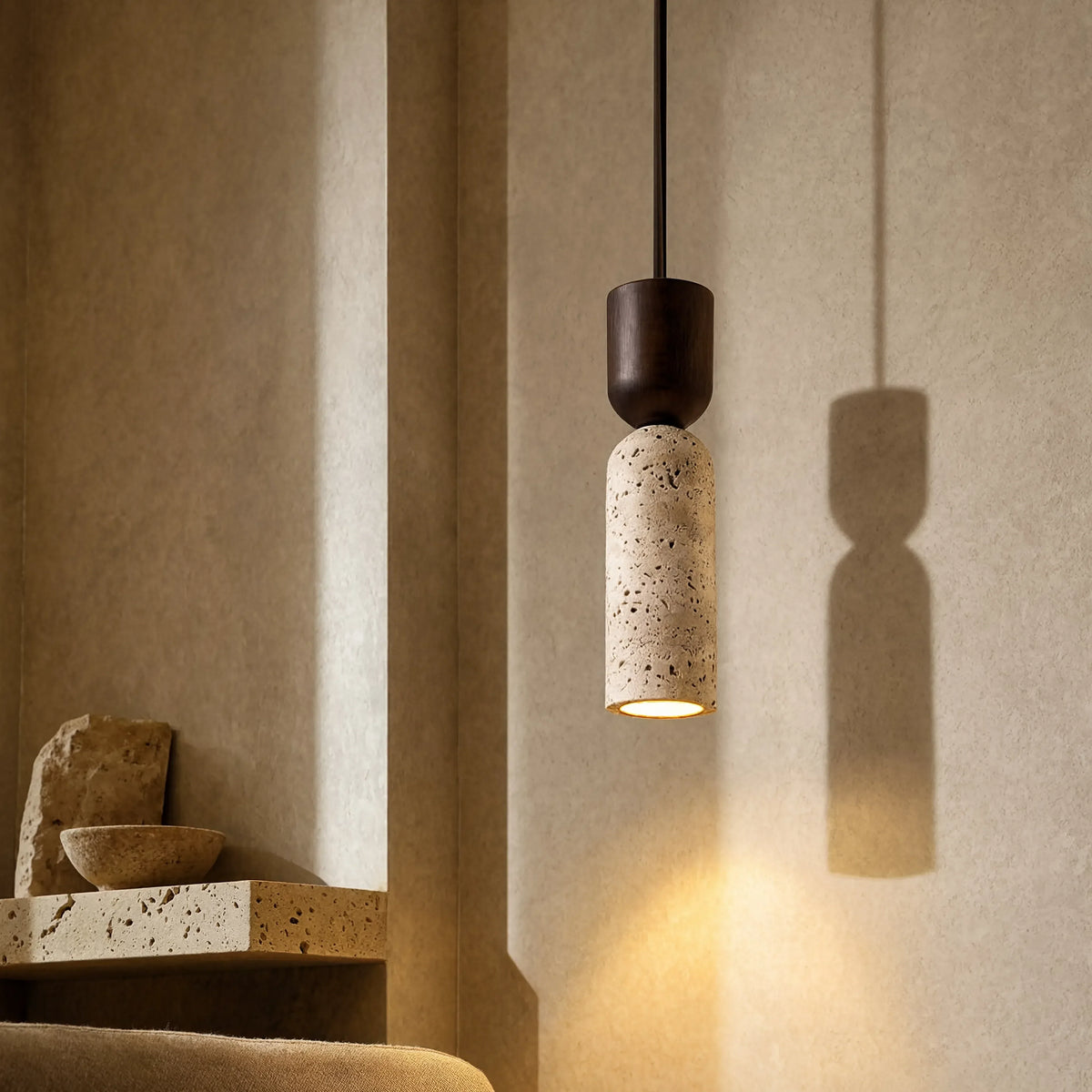 Ségeste narrow travertine and dark wood pendant light – shown in a living room (3)