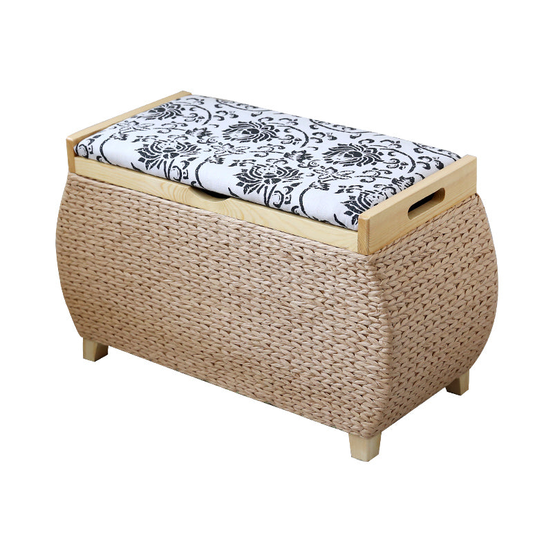Light rattan storage stool with black embroidered florals on the lid