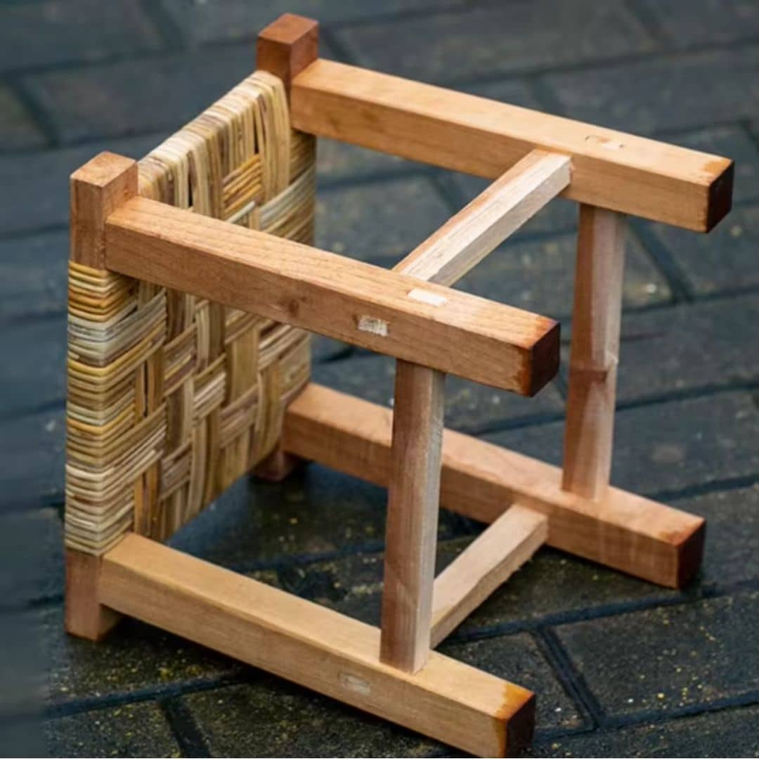Handmade square wicker stool on a solid wood frame – close-up detail