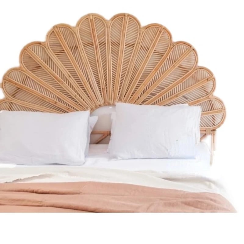 Rattan headboard with hand-braided fanned petals – shown in a room setting